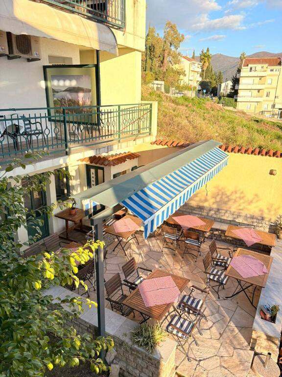Outdoor dining area with parasols at the hotel